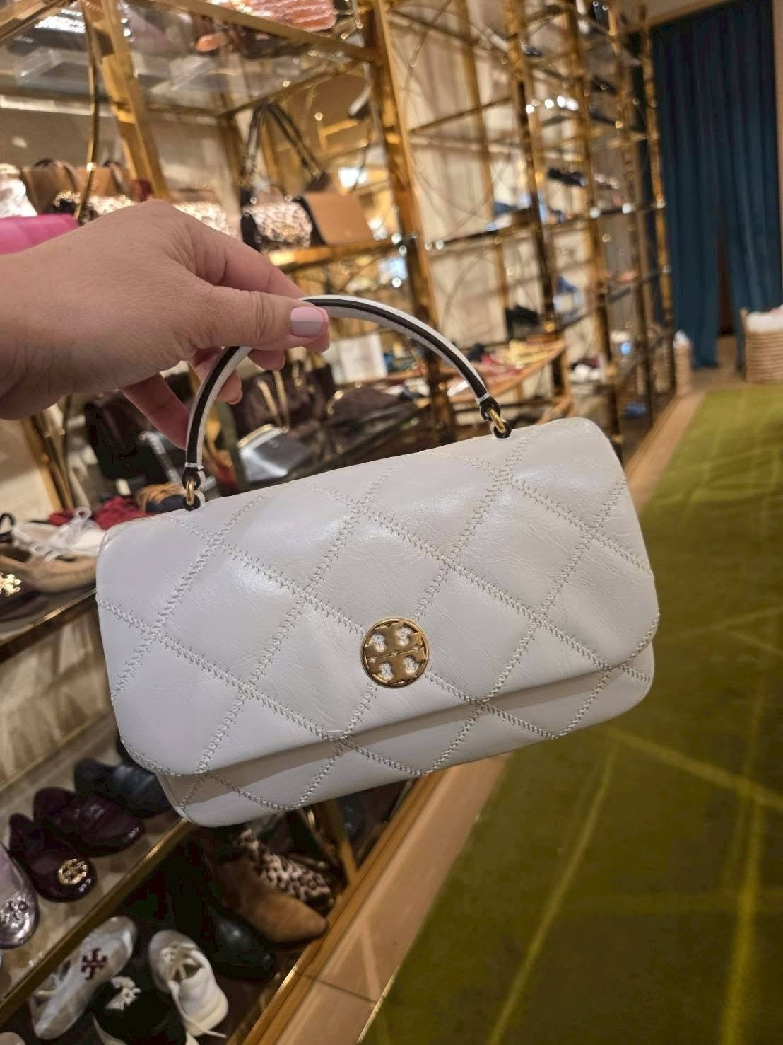 Tory Burch Willa Mini Top Handle Bag in a quilted, glossy patent leather